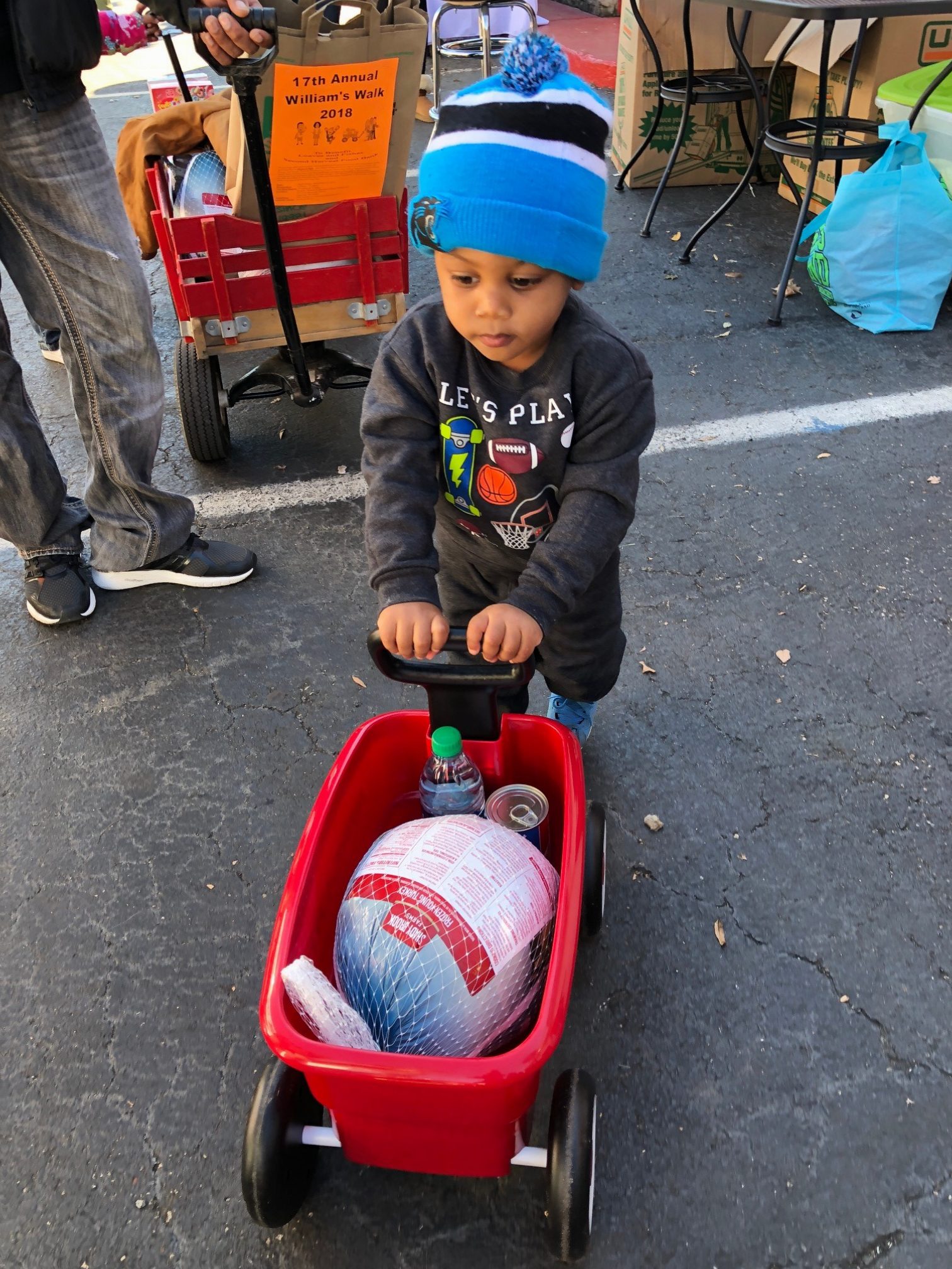 Little Boy with Turkey - Loaves & Fishes Food Pantry